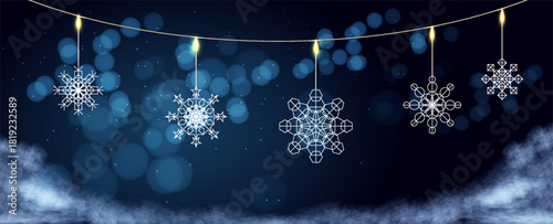 Decorative snowflakes hanging with glowing lights in a winter wonderland setting