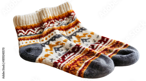 A pair of knitted wool socks with a Christmas pattern isolated on a white background, warm winter clothing accessories, a traditional Nordic style, soft cozy foot wear object.