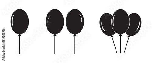 Simple black silhouettes of balloons floating.