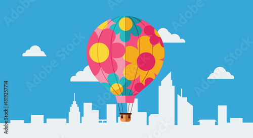 Colorful hot air balloon with a floral pattern flying over a white silhouette of a modern city skyline.