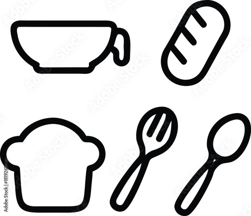 A close up of a black and white cat with green eyes