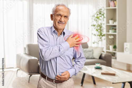 Elderly man with pain in shoulder