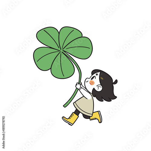 Joyful child running with a large four leaf clover silhouette