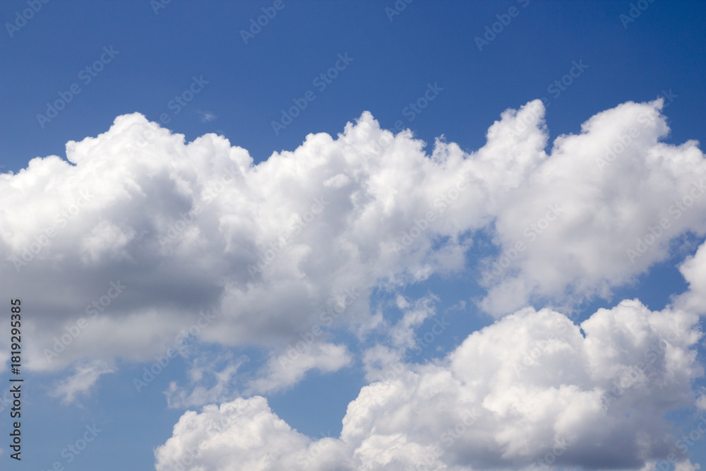 Fototapeta premium Beautiful sky with white clouds on a blue background
