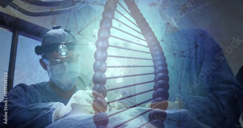 Operating surgeons performing surgery in OR, wearing sterile gowns and headlamp with DNA overlay