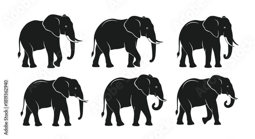 A collection of black silhouette elephants walking in various poses, showcasing their majestic presence and strength, ideal for minimalist designs.