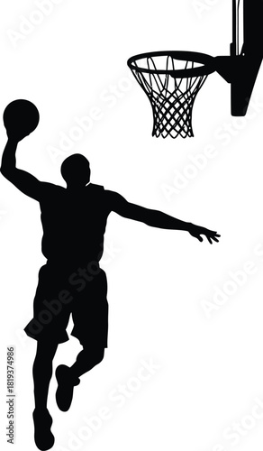 Silhouette of a basketball player jumping high to dunk a ball through a hoop