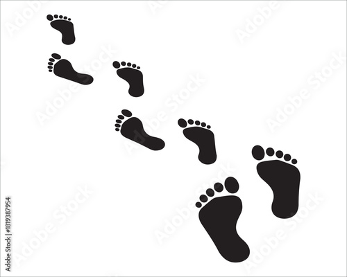 Footprints in the sand path to somewhere black and white