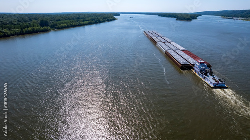 Aerial Journey of a Cargo Barge Along the Mighty Mississippi River