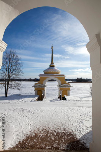 A view of the Bishop's Wharf. The Nilov-Stolobenskaya Hermitage on Lake Seliger, on Stolobny Island, on a sunny winter day. Tver Oblast, Russia.