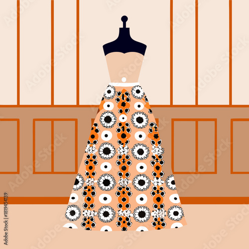 Fashionable orange floral dress on mannequin in a boutique setting