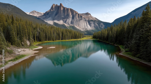 Emerald lake surrounded by dense forest, mountain reflection on calm water, peaceful natural landscape, clear sky, tranquil atmosphere