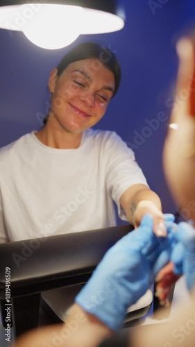 A happy, dreamy client getting her manicure done. High quality 4k footage