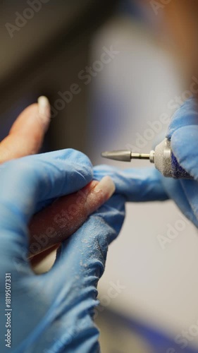 Close-up of removing old gel near the skin of a finger. High quality 4k footage