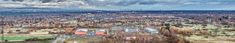 Fototapeta premium Wide drone panorama of Moerfelden-Walldorf and surrounding forest