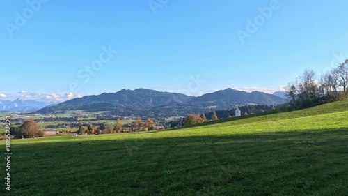 Meadows meet mountains near Oberstdorf, Germany on a bright, sunny afternoon