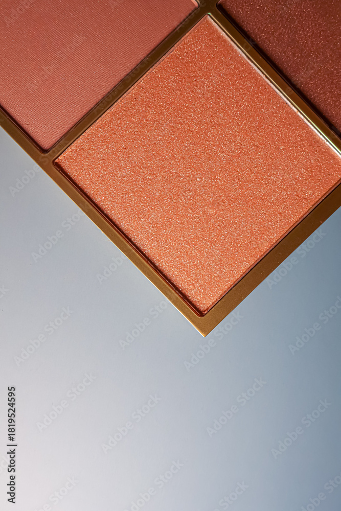Fototapeta premium Warm orange and coral eyeshadow palette with glitter texture accentuating cosmetic beauty and make up products