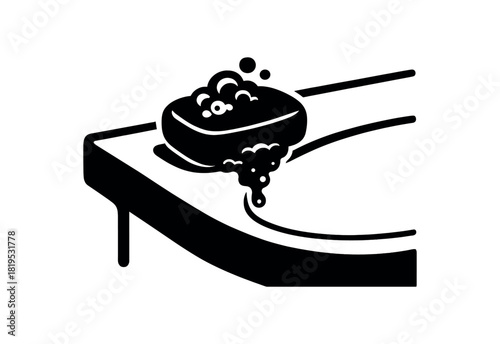 Soap bar resting on sink edge black silhouette with curve and foam line accents hygiene routine object