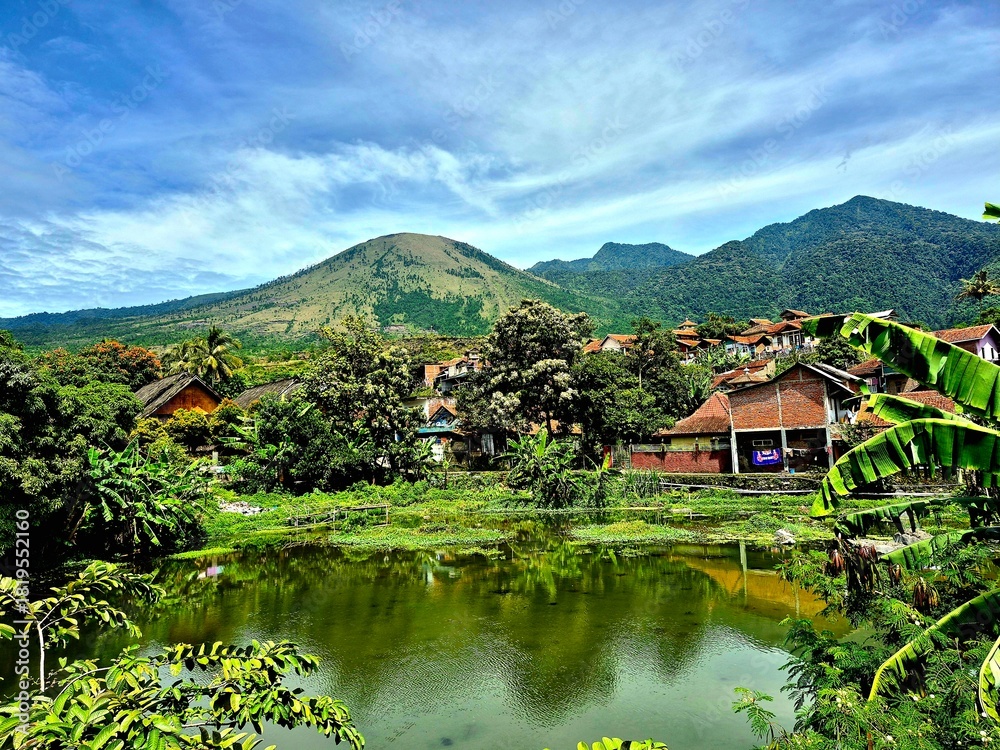 Fototapeta premium Beautiful Tropical Mountain Village Landscape with Lake