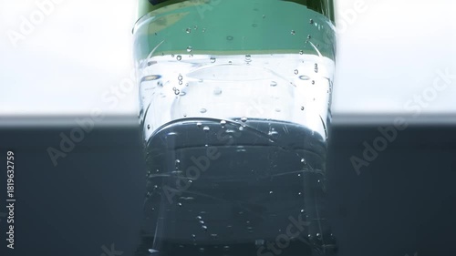 Closeup Blurred Shooting with Bubbles from a Botle with Accidulated Sweet and Fresh Drink.