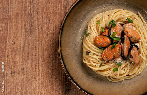 spaghetti with mussels, without shell, pasta with peeled mussels, in carbonara sauce, micro-greens, homemade, no people,