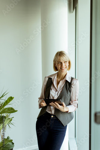 Businesswoman smiles while ...