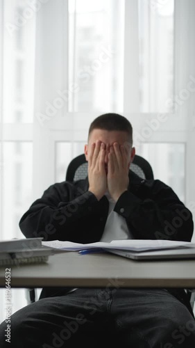 Business problems.
A sad businessman scatters documents and sits at his desk in a dejected mood.
Sadness and problems.
Company bankruptcy and an angry manager in the office.