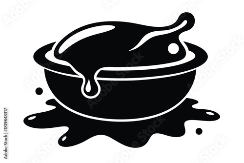 Dark liquid spills generously from a round bowl, creating puddles around it in a monotone