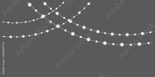 String lights hanging on a dark gray background