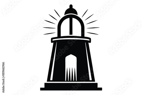 The shining black lighthouse casts long rays of light as it stands tall