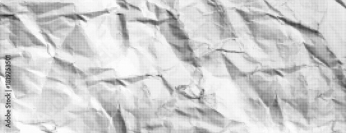 Halftone paper background with rough crumpled texture. Grunge vintage note sheet or package. Abstract simple black and white newspaper. Noise or grain effect. Pattern backdrop