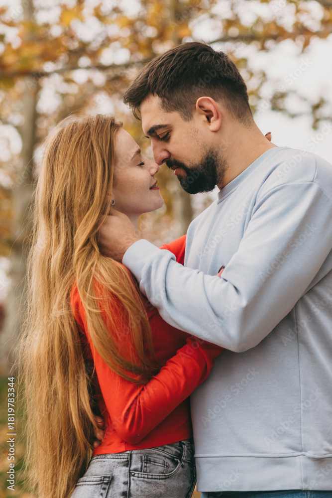 Fototapeta premium autumn park nurtures silent intimacy, soft touches and autumn scenery evoke deep mutual understanding