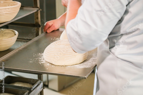 Canvas Print Women knead dough in a bakery