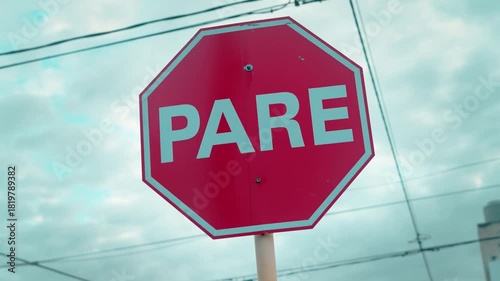 Detailed close-up of a red PARE stop sign