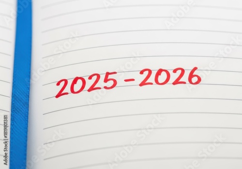 2025-2026 written in red marker on a lined notebook page, planning concept