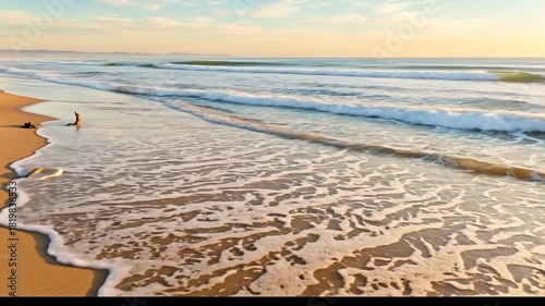 Golden Hour Serenity: Dynamic Ocean Waves Gently Wash Sandy Beach Shoreline