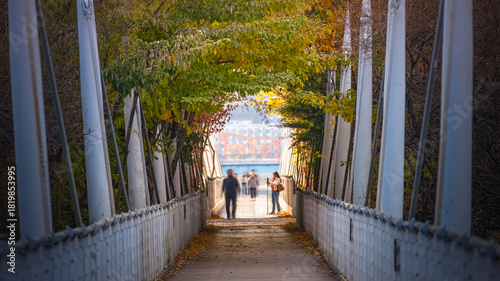 Canvas Print At the end of the tunnel made of thick tree branches, the Han River is visible