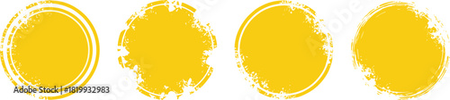 Abstract set of four vibrant yellow grunge circular brush stroke textures, perfect for graphic design elements, backgrounds, or artistic overlays with a distressed and messy ink effect