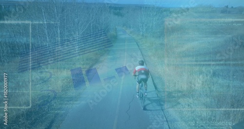 Pedaling teenage cyclist riding on rural paved road with road bicycle, helmet, jersey, copy space
