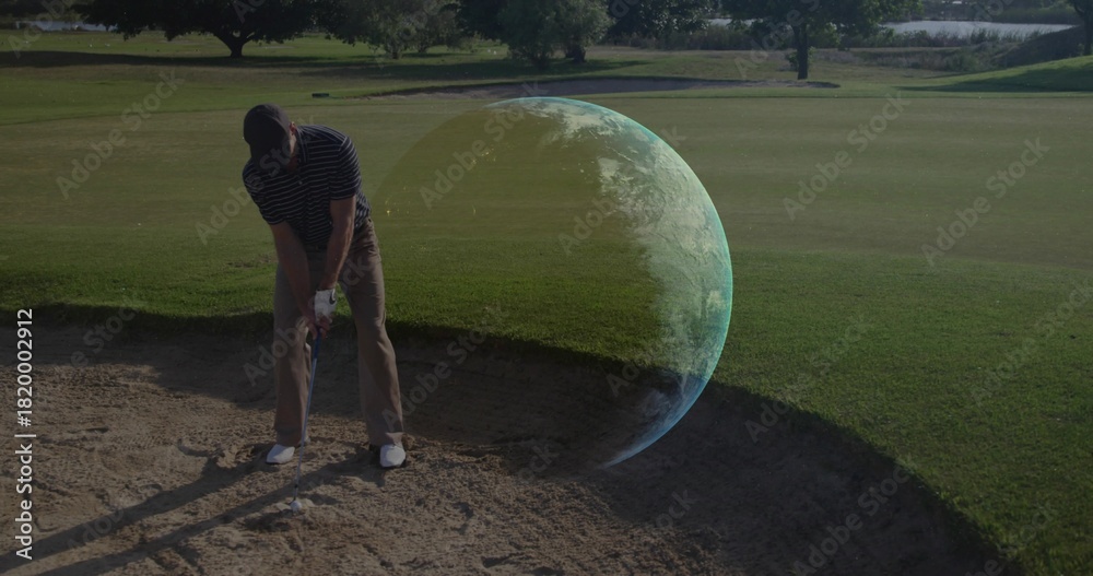 Obraz premium Preparing golfer in golf attire lining up iron shot in bunker with Earth-like hologram, copy space