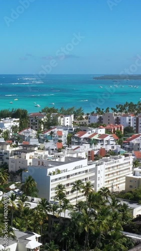 Caribbean coastline with resorts, palm trees and tropical sea. Travel destinations. Dominican Republic. Aerial view
