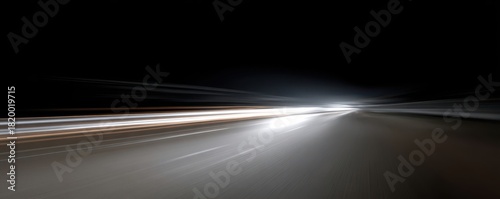 Abstract nighttime long exposure of car lights on the road