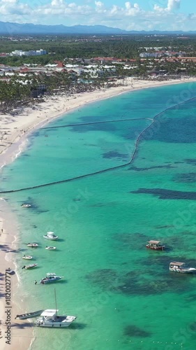 Caribbean coastline with resorts, palm trees and tropical sea. Travel destinations. Dominican Republic. Aerial view