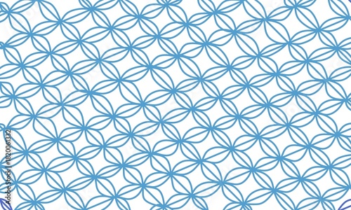 Illustration of a repeating geometric pattern in blue. The repeating oval pattern resembles a batik design.
