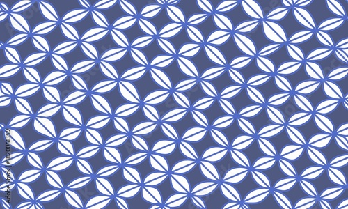 Illustration of a repeating geometric pattern in blue. The repeating oval pattern resembles a batik design.