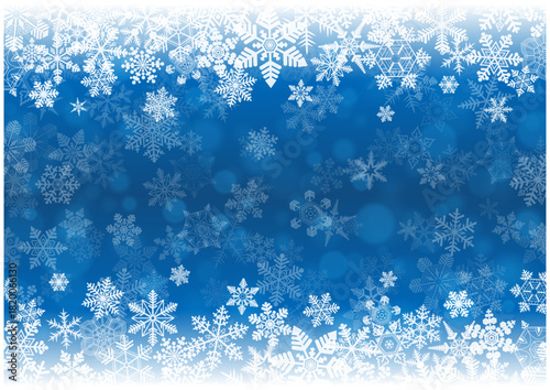 白い雪の結晶が散りばめられた冬の幻想的な青いベクター背景