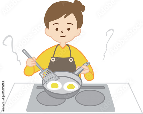 フライパンで料理をする女性