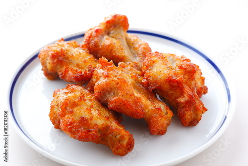 あぶり焼きチキン - 骨付き手羽元を焼き上げた、ジューシーな炙り焼きチキン
