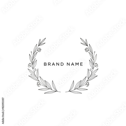 Elegant botanical wreath design with brand name for sophisticated branding.