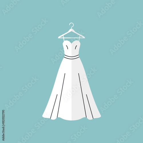 A white wedding dress hangs from a hanger.